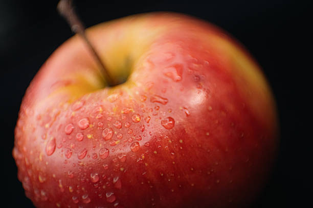 istock Macro Shot of Fresh Red Apple with Water Droplets 2225328419