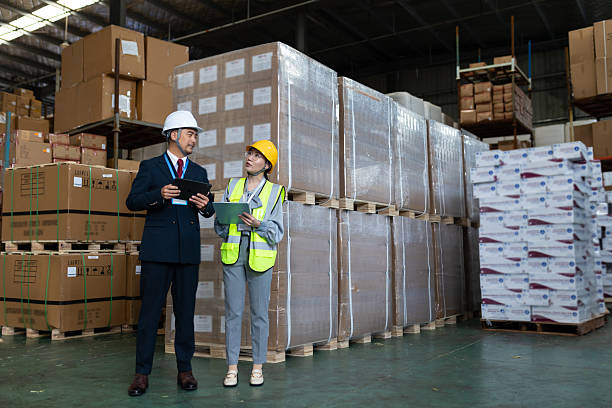 istock An Asian male manager and a logistic engineer discussed over a tablet computer to audit and improve the warehouse's operations and workflow for increased customer satisfaction growth. 2225329263