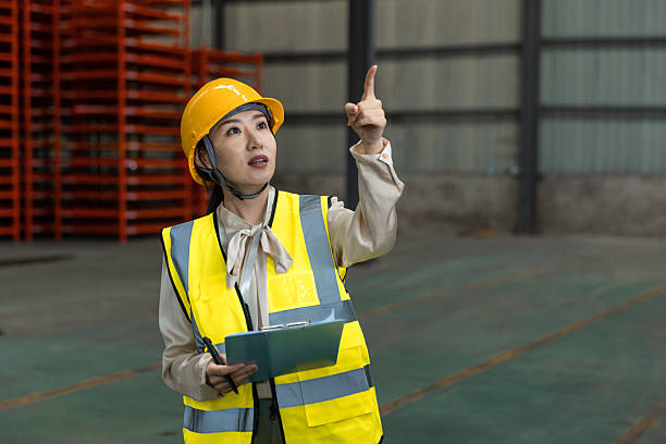 istock One Asian Females Worker Checklist Cargo at Warehouse 2225330349