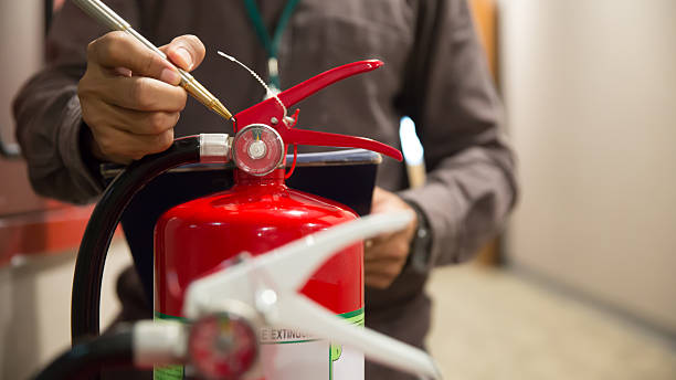istock Engineers are checking fire extinguishers in in building for protection and prevent for emergency and safety rescue and fire training. 2225333741