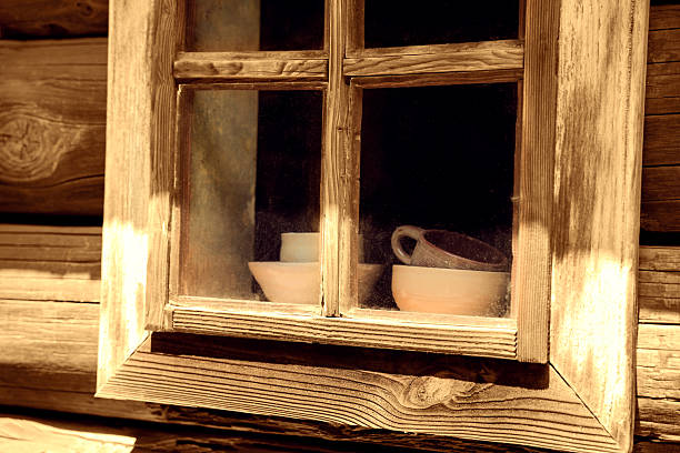 Ceramic cups seen through an apartment window in a towns on the island of Île de Ré, France