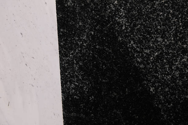 istock Granite contrasts: a stark white expanse meets a dark speckled section highlighting texture and color differences 2225340459