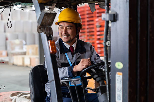 istock One Asian Worker Driving Forklift in Distribution Warehouse 2225341560