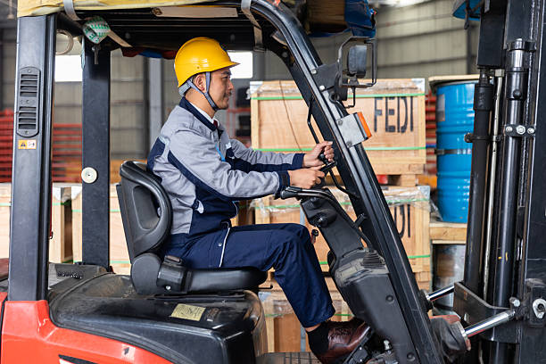 istock One Asian Worker Driving Forklift in Distribution Warehouse 2225341694