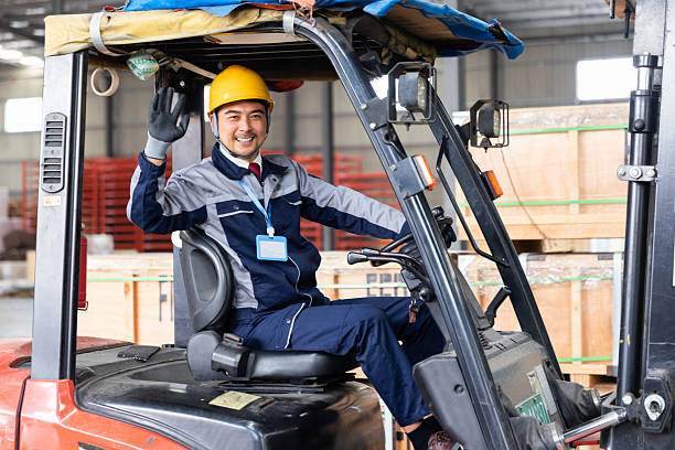 istock One Asian Worker Driving Forklift in Distribution Warehouse 2225341773