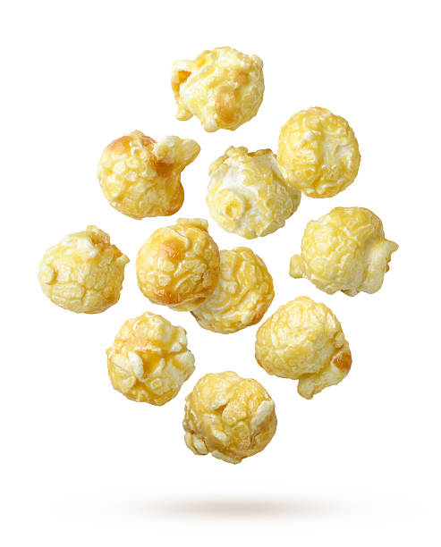 istock Caramel popcorn flying close-up on a white. Isolated 2225341804