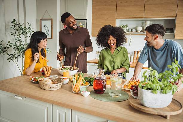 istock Friends preparing a meal together 2225342362