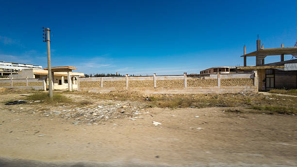 istock Barren Landscape with Unfinished Building 2225342370