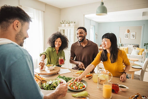 istock Friends preparing a meal together 2225342635
