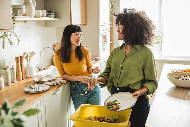 istock Friends doing dishes after  dinner party 2225342901