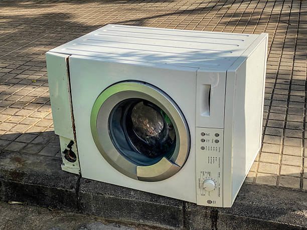 istock Broken washing machine left in the street 2225344431