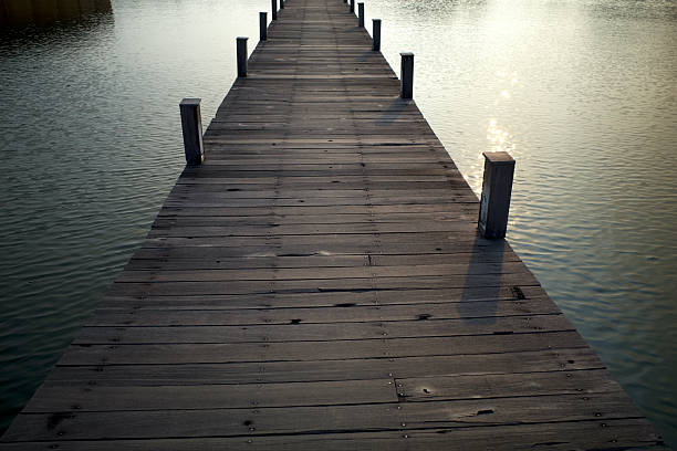 istock An old wooden bridge over an artificial lake in Semarang, Central Java, Indonesia 2225345702