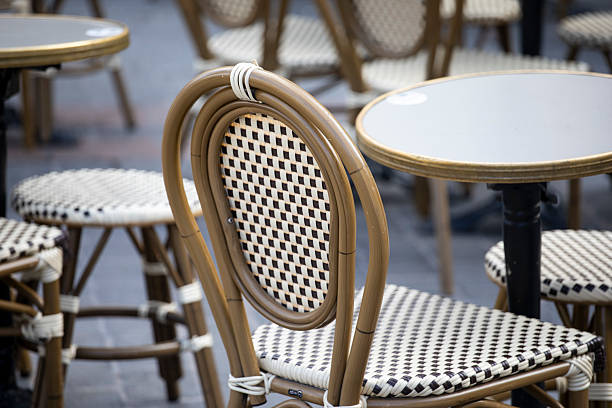 istock Close-up of empty pavement cafe chair and table 2225346359