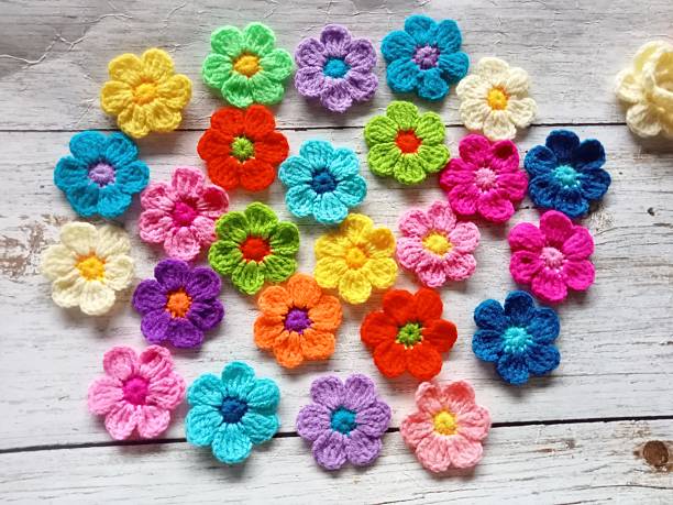istock Crocheted flowers, handmade crochet for decoration illustration background texture 2225346613