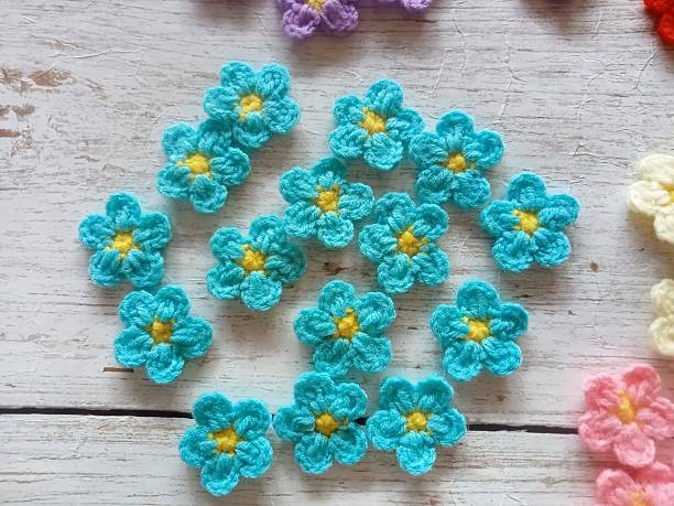 istock Crocheted flowers, handmade crochet for decoration illustration background texture 2225346823