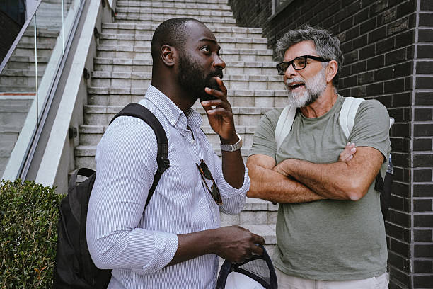 istock Two friends exploring the city and having fun conversation 2225349346