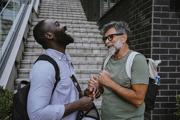 istock Two friends exploring the city and having fun conversation 2225349351