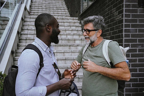 istock Two friends exploring the city and having fun conversation 2225349417
