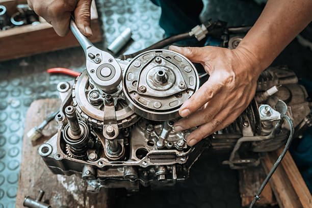 istock Motorcycle Engine Rebuild,  Mechanic use Socket Wrench Handle repairing Engine ,working at garage,  motorcycle repair concept 2225355885