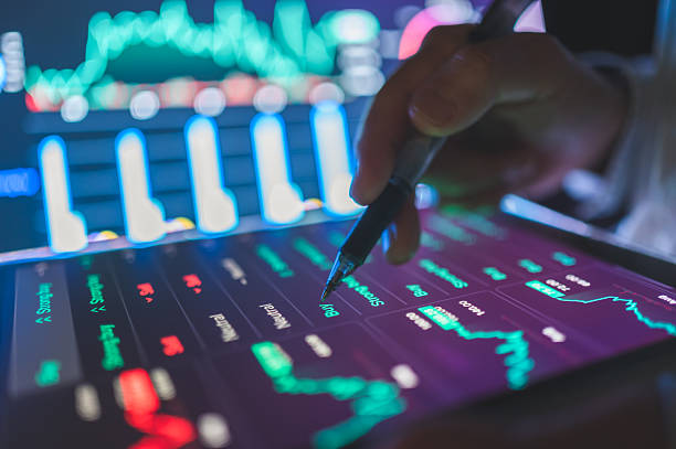 istock hand using smartphone and digital stylus on tablet to review ai-generated financial charts and trading patterns financial data visualization on smart devices for personal investing, stock analysis, and business forecasting 2225358329