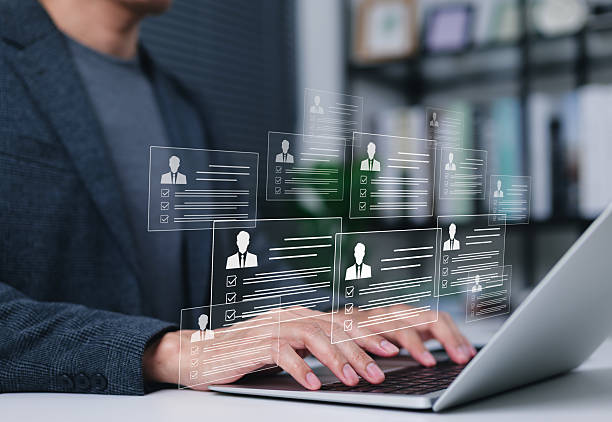 istock Human Resources and Employee Profile Management. Person using laptop with employee profiles, checklists, and personal data, CV online, human resources, recruitment, candidate, workforce in workplace, 2225358411