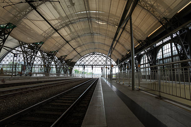 Dresden central station building from the train platform. The restored rooftop is covered by a textile net. The material of the new roof segments is a glass fiber membrane.