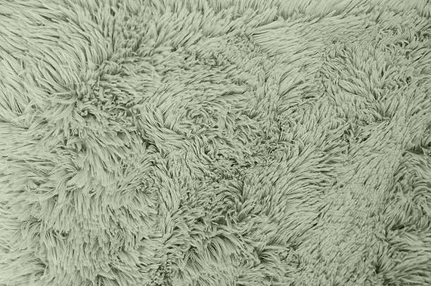 istock Close up view of a fluffy, green fabric texture, perfect for backgrounds or design elements. 2225360742