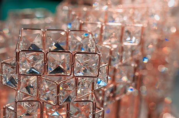 Closeup of lit candles on a brick fireplace mantle.