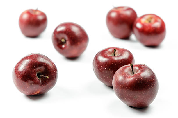 istock Close-up of fresh red apples on a white background 2225362116