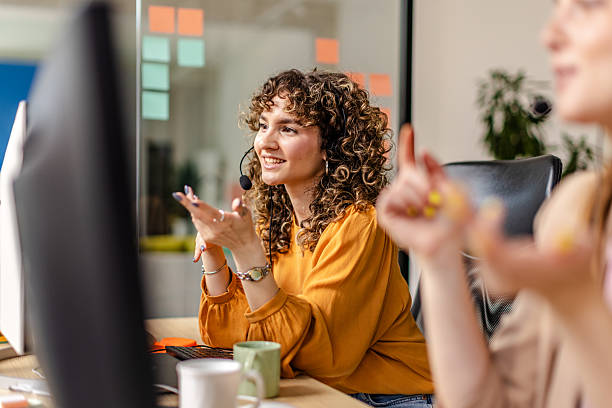 istock Collaborating in a modern office setting where employees engage in productive teamwork and discussions 2225362174