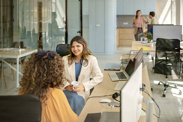 istock Collaboration among colleagues in a modern office environment during a busy workday 2225362244