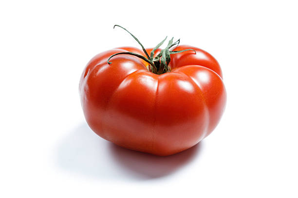 istock Fresh ripe tomato isolated on a white background with vibrant colors 2225362480