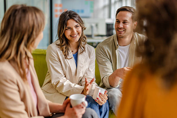 istock Collaboration and discussion among colleagues in a vibrant office setting 2225362517