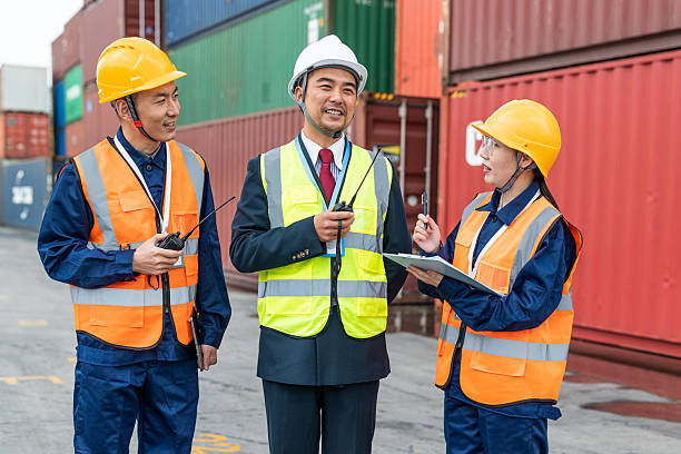 istock Teams of Asian logistics engineers having a discussion at a cargo container yard about supporting relevant departments in carrying out cargo handling operations. 2225362844