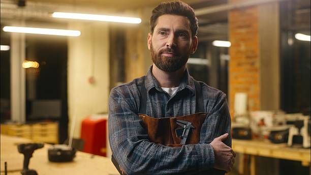 istock Contemplative Caucasian guy thinking writing notebook in workshop male wood master joiner carpenter lost in thought confused artist man builder planning work project architect idea eureka inspiration 2225363102
