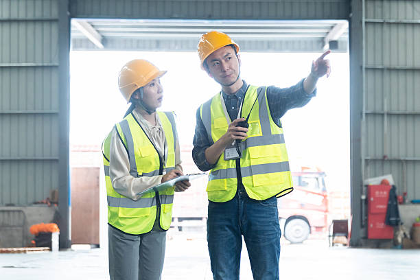 istock Two Asian Warehouse Inspector Examining in Chemicals Warehouse 2225363770