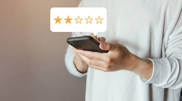 istock close up on customer man use smartphone and hand pressing two star (poor rating) feedback rank for give score point to review the service and experience on business concept 2225365277