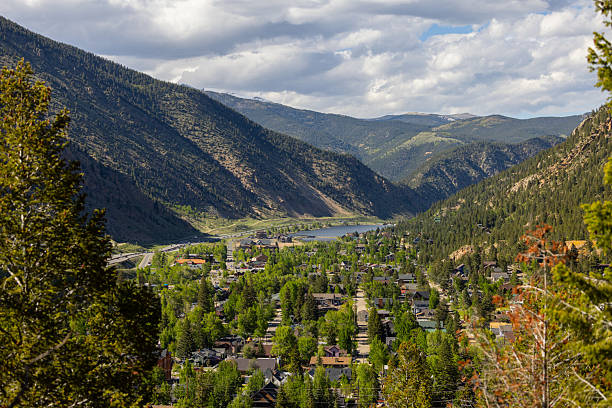 istock Large Mountain Tops amongts a Green Valley Landscape 2225365468