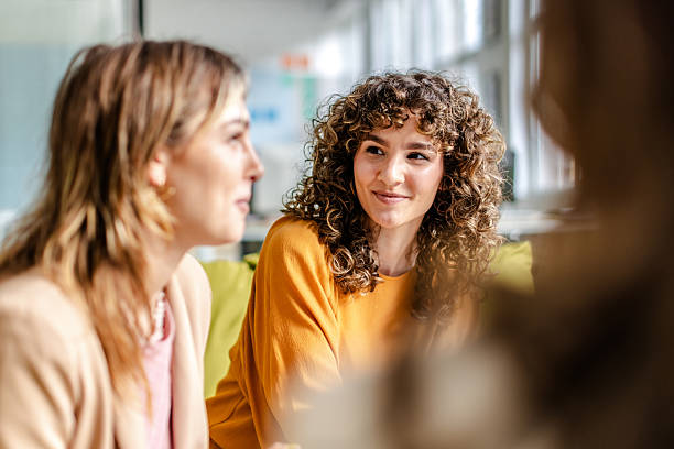 istock Colleagues engaged in a productive discussion during a meeting in a modern office workspace 2225365497