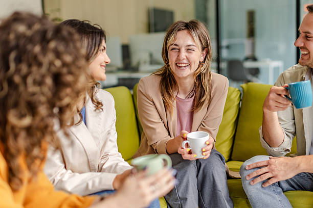 istock Colleagues sharing ideas and laughter during a team meeting in a modern office setting 2225365777