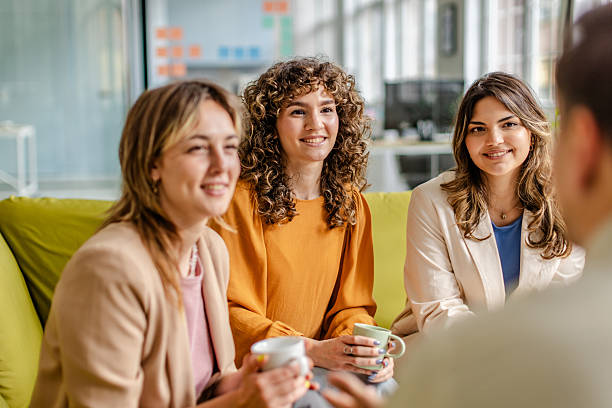 istock Discussing ideas over coffee in a modern office environment with a team of professionals 2225365974