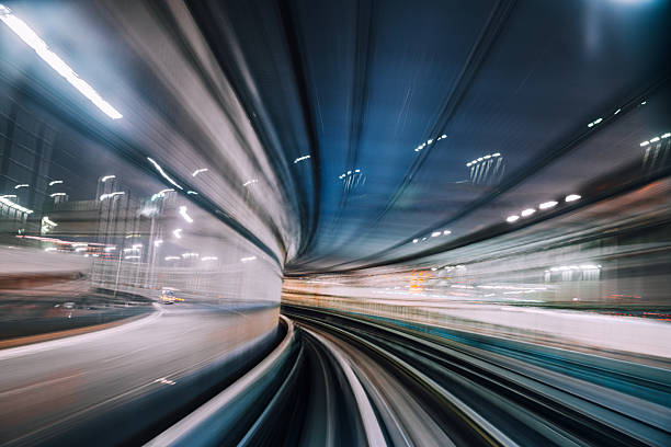 istock High-Speed Nighttime Motion Blur of a Modern Monorail Tunnel 2225366757