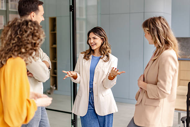 istock Engaging teamwork conversation among colleagues in a modern office setting during a productive meeting 2225369157