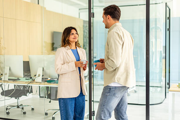 istock Office collaboration between colleagues in a modern workspace focused on teamwork and professional growth 2225369995