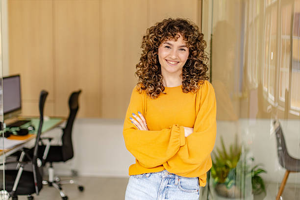 istock Professional woman smiling in modern office environment during collaborative meeting with colleagues 2225371270