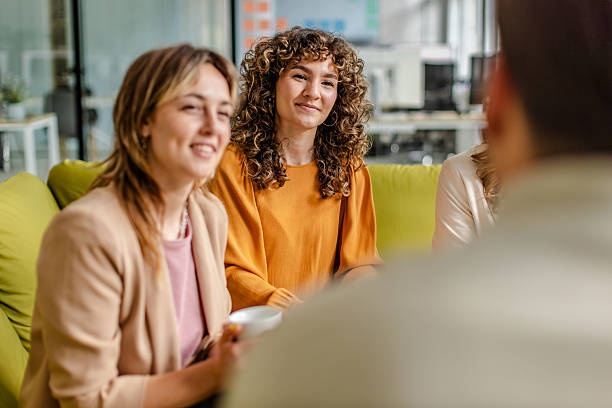 istock Team collaborates in a modern office space while discussing project ideas and strategies 2225371994