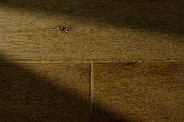 istock Close-up of wooden texture with intricate grain patterns and dim lighting 2225373307
