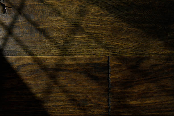 istock Wooden surface with natural patterns and subtle shadows in warm lighting 2225373398
