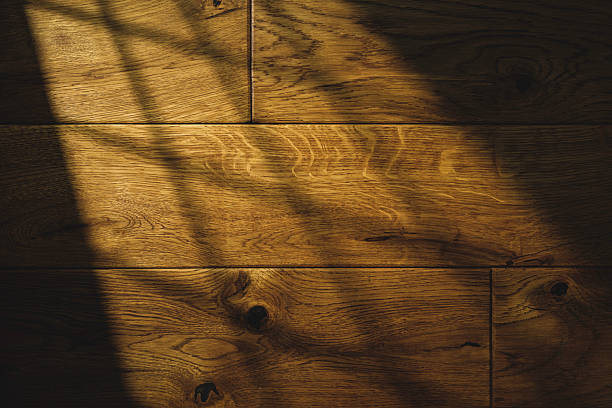 istock Wooden surface with natural patterns and subtle shadows in warm lighting 2225373546