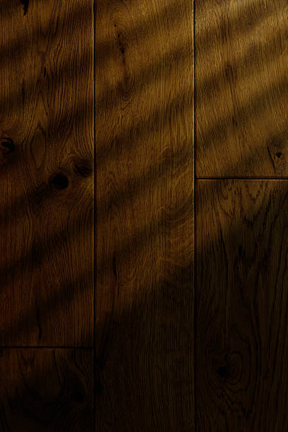 Wooden surface with natural patterns and subtle shadows in warm lighting